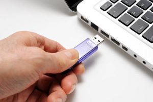 Insert your flash drive into your computer’s USB port.